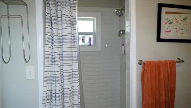 5007 Euclid Ave, Kansas City, MO 64130 - full bathroom with tiled shower