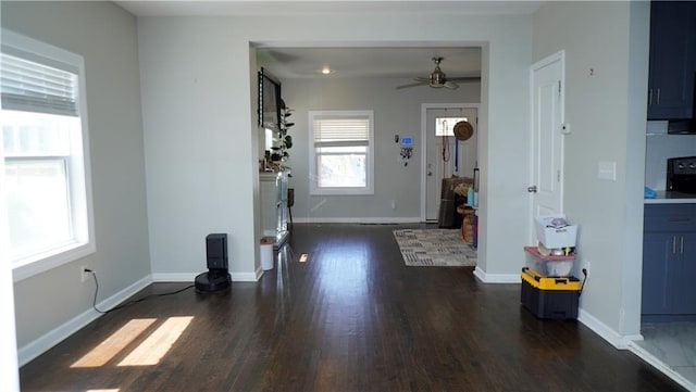 5007 Euclid Ave, Kansas City, MO 64130 - living area with dark wood-style flooring and a ceiling fan