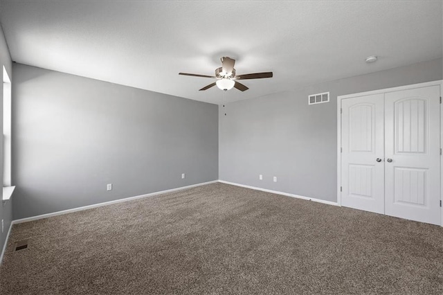 2814 N 100th St, Kansas City, KS 66109 - unfurnished bedroom featuring carpet flooring, a closet, and ceiling fan