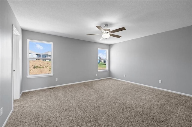2814 N 100th St, Kansas City, KS 66109 - carpeted empty room featuring a ceiling fan and a textured ceiling
