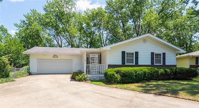 2618 Manor Ter, Lawrence, KS 66046 - ranch-style house featuring driveway and a garage