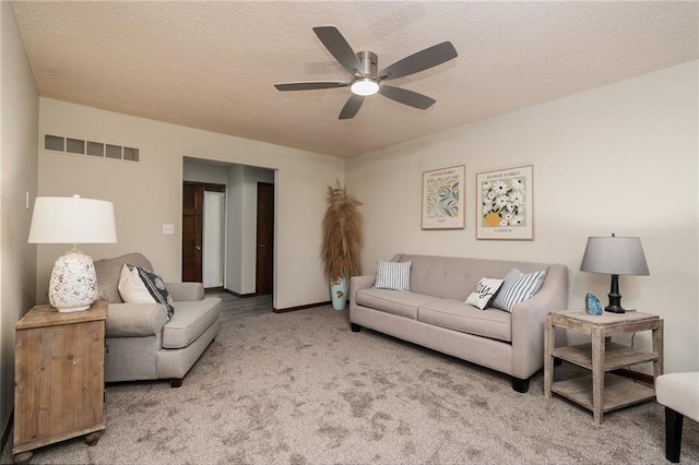 2618 Manor Ter, Lawrence, KS 66046 - living room featuring carpet flooring, a ceiling fan, and a textured ceiling