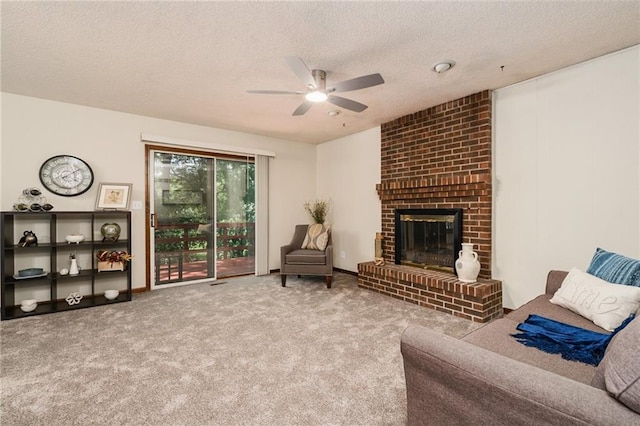 2618 Manor Ter, Lawrence, KS 66046 - carpeted living room featuring a ceiling fan, a textured ceiling, and a brick fireplace