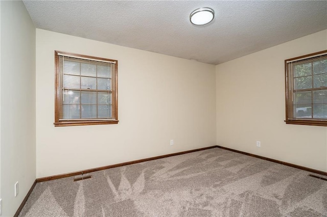 2618 Manor Ter, Lawrence, KS 66046 - carpeted spare room with a textured ceiling