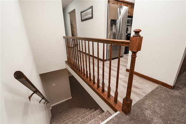 2618 Manor Ter, Lawrence, KS 66046 - stairs with carpet flooring and baseboards