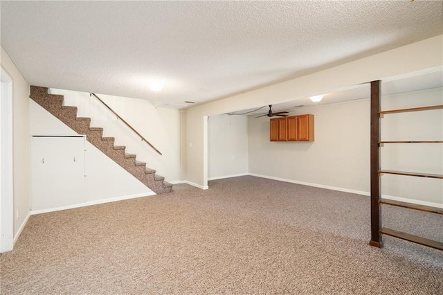 2618 Manor Ter, Lawrence, KS 66046 - finished basement with stairway, carpet, and a textured ceiling