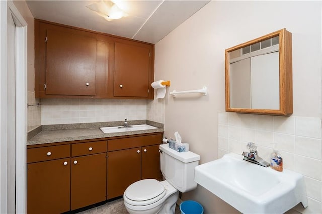 2618 Manor Ter, Lawrence, KS 66046 - bathroom with decorative backsplash and tile walls