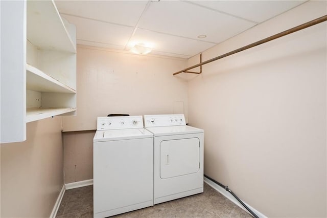 2618 Manor Ter, Lawrence, KS 66046 - washroom featuring washer and clothes dryer and light tile patterned floors