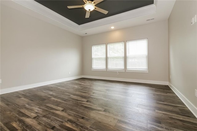 15904 E Cogan Ln, Independence, MO 64050 - unfurnished room featuring a tray ceiling, ceiling fan, dark wood-style floors, recessed lighting, and ornamental molding