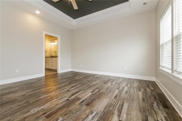 15904 E Cogan Ln, Independence, MO 64050 - unfurnished room with a tray ceiling, plenty of natural light, ceiling fan, dark wood finished floors, and ornamental molding