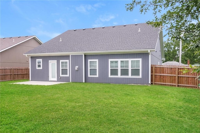 15904 E Cogan Ln, Independence, MO 64050 - rear view of property featuring a patio, a fenced backyard, and a shingled roof
