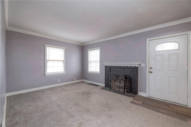 904 E 84th St, Kansas City, MO 64131 - unfurnished living room featuring ornamental molding, carpet, and a fireplace