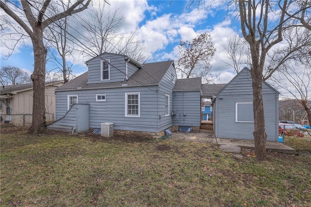 904 E 84th St, Kansas City, MO 64131 - rear view of house featuring roof with shingles