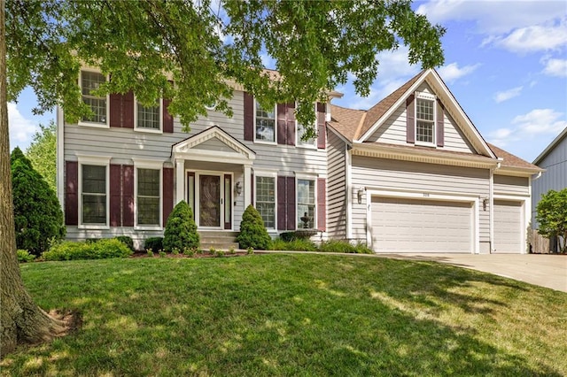 508 Ambersham Dr, Lees Summit, MO 64081 - view of front of home with concrete driveway, a front yard, and an attached garage