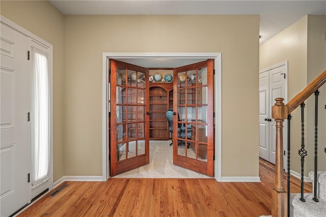 508 Ambersham Dr, Lees Summit, MO 64081 - foyer entrance with wood finished floors, french doors, and stairway