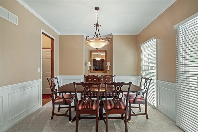 508 Ambersham Dr, Lees Summit, MO 64081 - dining space with light carpet, ornamental molding, wainscoting, and a decorative wall