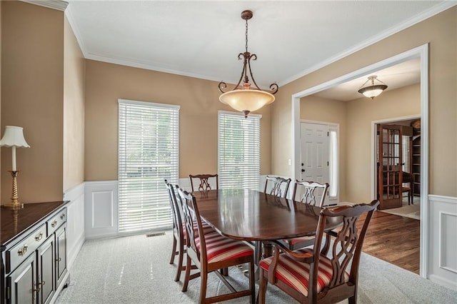 508 Ambersham Dr, Lees Summit, MO 64081 - dining area featuring crown molding, wainscoting, and a decorative wall