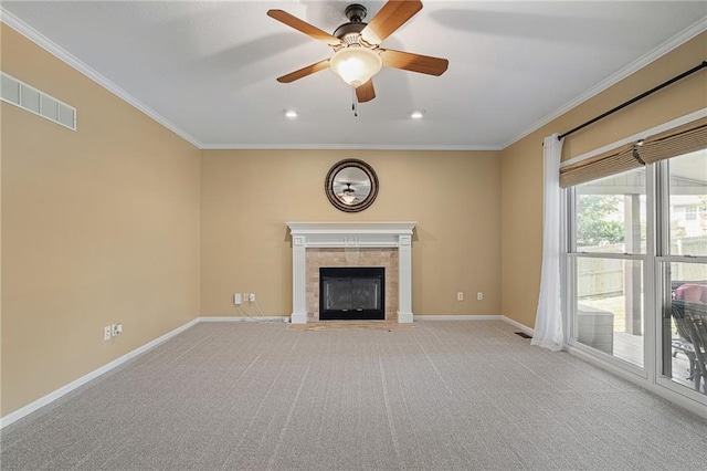 508 Ambersham Dr, Lees Summit, MO 64081 - unfurnished living room featuring ornamental molding, a tile fireplace, a ceiling fan, light carpet, and recessed lighting