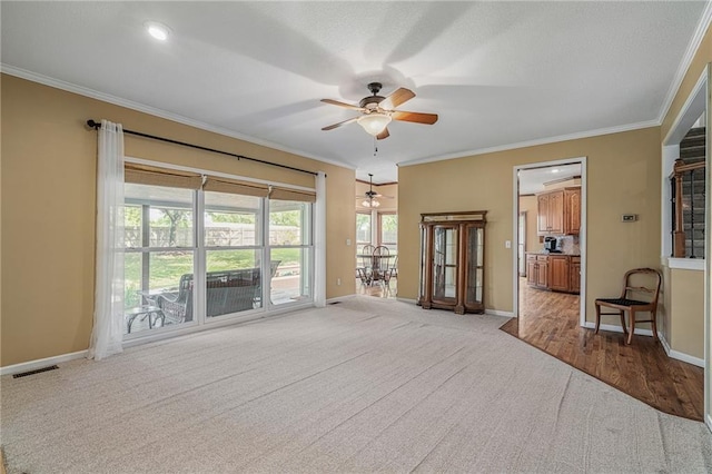 508 Ambersham Dr, Lees Summit, MO 64081 - spare room with light carpet, ceiling fan, and ornamental molding