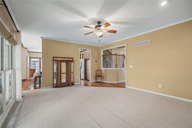 508 Ambersham Dr, Lees Summit, MO 64081 - carpeted spare room featuring ceiling fan and crown molding