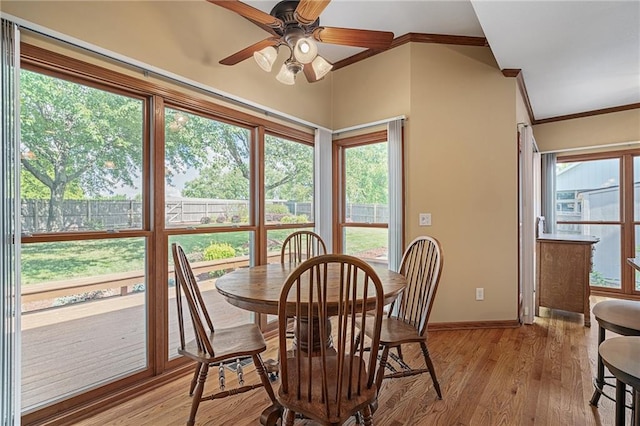 508 Ambersham Dr, Lees Summit, MO 64081 - dining area with crown molding, a ceiling fan, healthy amount of natural light, and light wood-type flooring