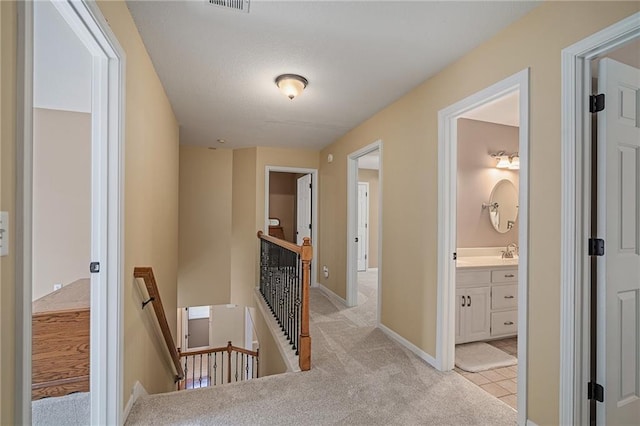 508 Ambersham Dr, Lees Summit, MO 64081 - hallway with an upstairs landing and light carpet