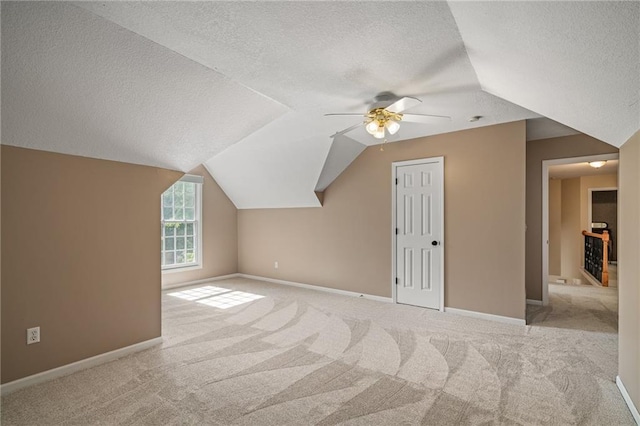 508 Ambersham Dr, Lees Summit, MO 64081 - bonus room with a textured ceiling, ceiling fan, vaulted ceiling, and carpet floors