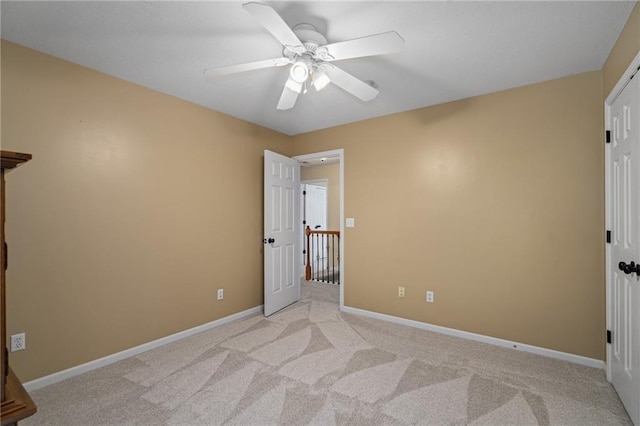 508 Ambersham Dr, Lees Summit, MO 64081 - unfurnished bedroom featuring light colored carpet and ceiling fan