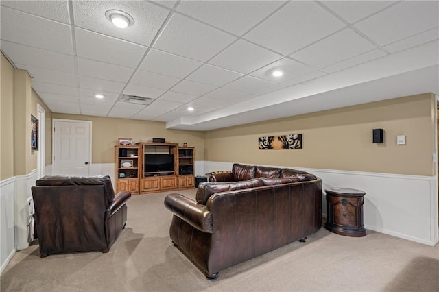 508 Ambersham Dr, Lees Summit, MO 64081 - living area featuring light carpet, a drop ceiling, and wainscoting