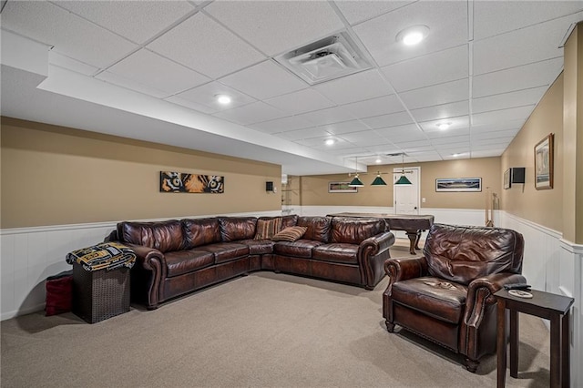 508 Ambersham Dr, Lees Summit, MO 64081 - carpeted living area featuring wainscoting and a drop ceiling
