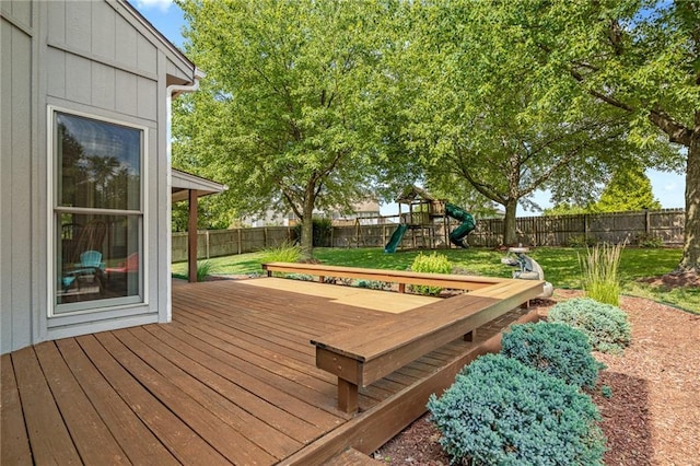 508 Ambersham Dr, Lees Summit, MO 64081 - wooden terrace with a fenced backyard and a playground