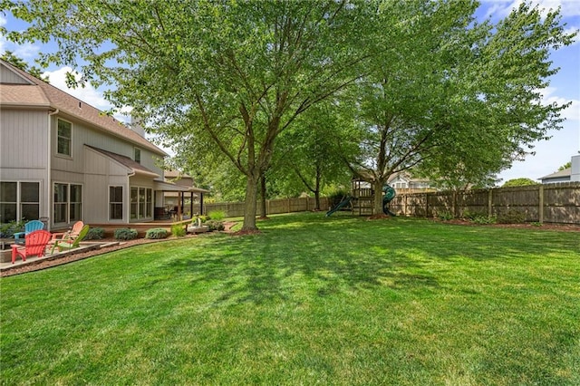 508 Ambersham Dr, Lees Summit, MO 64081 - fenced backyard with a playground and a patio area