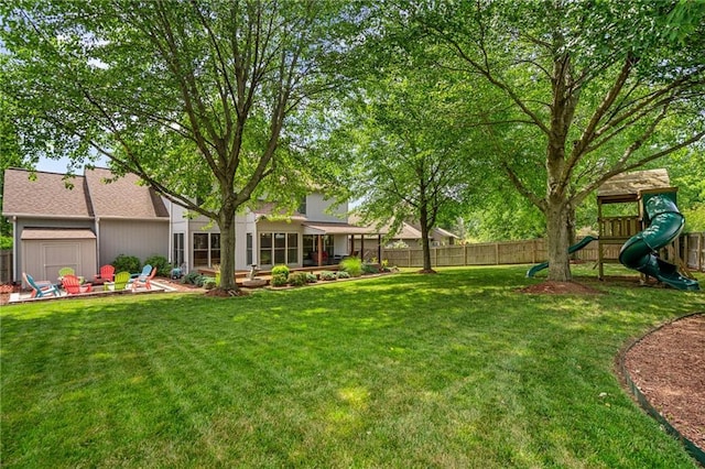 508 Ambersham Dr, Lees Summit, MO 64081 - fenced backyard with a playground and a sunroom