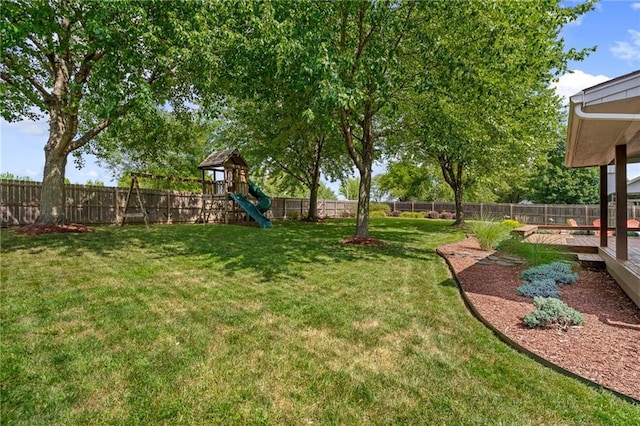 508 Ambersham Dr, Lees Summit, MO 64081 - fenced backyard with a playground and a wooden deck