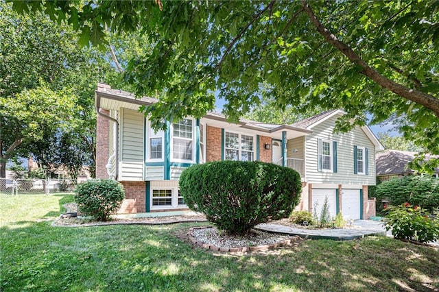 6319 Acuff St, Shawnee, KS 66216 - view of front facade with brick siding and an attached garage