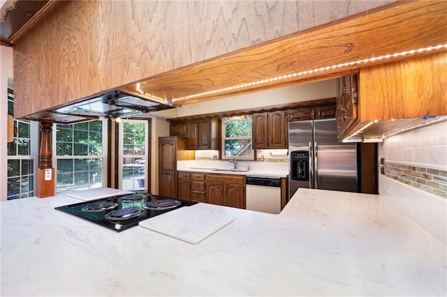 6319 Acuff St, Shawnee, KS 66216 - kitchen with stainless steel refrigerator with ice dispenser, decorative backsplash, cooktop, and white dishwasher