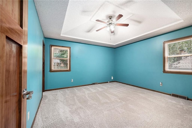 6319 Acuff St, Shawnee, KS 66216 - unfurnished room featuring a textured ceiling, carpet floors, and a ceiling fan