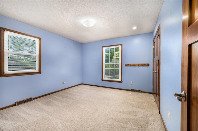 6319 Acuff St, Shawnee, KS 66216 - unfurnished bedroom featuring carpet and a textured ceiling
