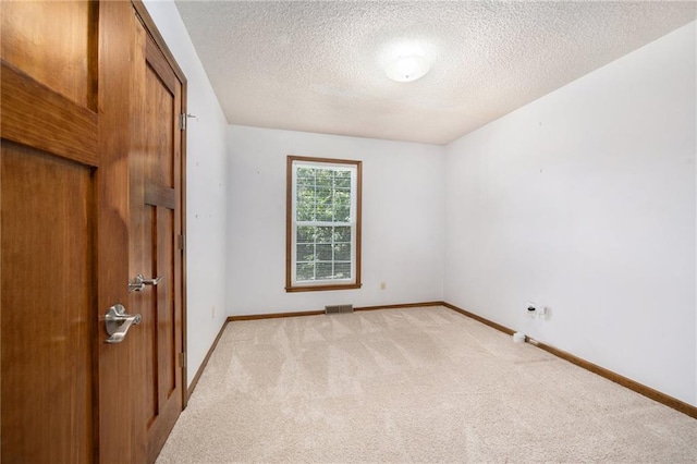 6319 Acuff St, Shawnee, KS 66216 - spare room featuring light colored carpet and a textured ceiling