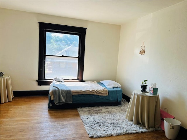 817 S 16th St, Saint Joseph, MO 64501 - bedroom featuring wood finished floors and baseboards