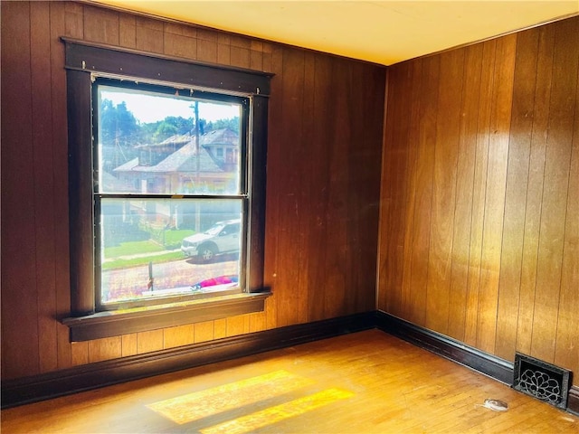 817 S 16th St, Saint Joseph, MO 64501 - empty room featuring wood finished floors and wood walls
