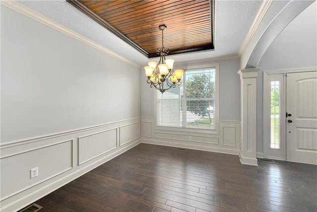 28617 W 162nd Ter, Gardner, KS 66030 - entrance foyer with a chandelier, dark wood-type flooring, arched walkways, crown molding, and a wainscoted wall
