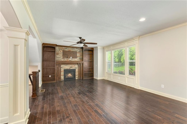 28617 W 162nd Ter, Gardner, KS 66030 - unfurnished living room featuring a textured ceiling, a ceiling fan, ornamental molding, a fireplace, and wood-type flooring