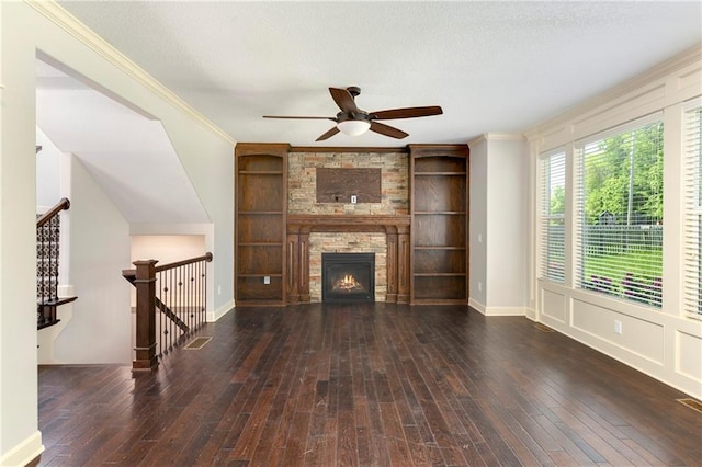 28617 W 162nd Ter, Gardner, KS 66030 - unfurnished living room with ceiling fan, hardwood / wood-style floors, ornamental molding, a fireplace, and a textured ceiling