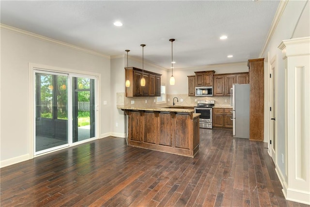 28617 W 162nd Ter, Gardner, KS 66030 - kitchen with a peninsula, stainless steel appliances, backsplash, decorative light fixtures, and dark wood-style flooring