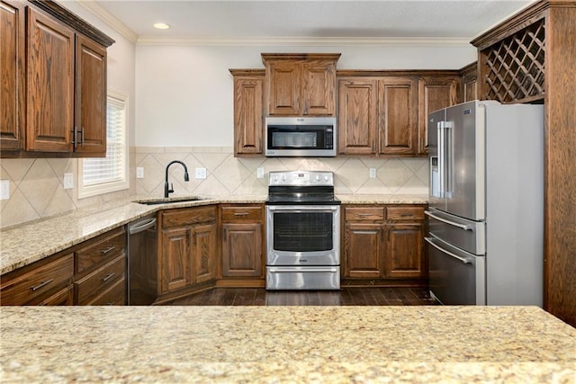 28617 W 162nd Ter, Gardner, KS 66030 - kitchen with stainless steel appliances, ornamental molding, dark wood-style floors, light stone countertops, and tasteful backsplash