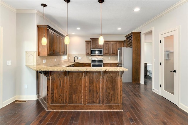28617 W 162nd Ter, Gardner, KS 66030 - kitchen with a peninsula, appliances with stainless steel finishes, dark wood-style flooring, tasteful backsplash, and ornamental molding