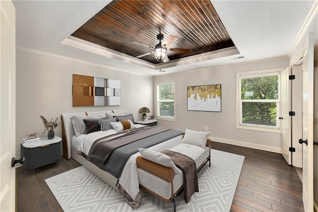 28617 W 162nd Ter, Gardner, KS 66030 - bedroom with a tray ceiling, dark wood-type flooring, crown molding, ceiling fan, and wood ceiling