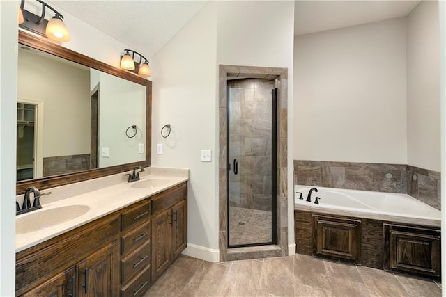 28617 W 162nd Ter, Gardner, KS 66030 - bathroom featuring double vanity, a garden tub, and a stall shower