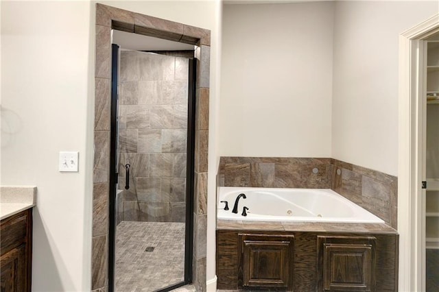 28617 W 162nd Ter, Gardner, KS 66030 - bathroom featuring a tub with jets, a stall shower, and vanity